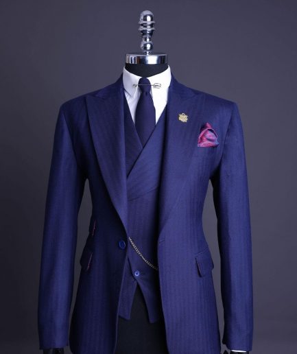 A Navy Blue, Herringbone Nobility Super “140s” “Board Room” Peak Lapel Suit
