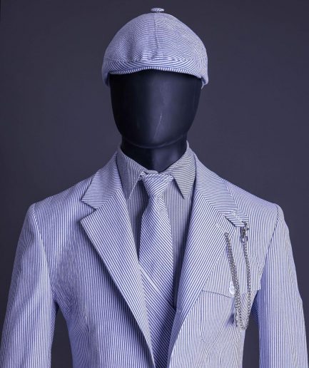 A monochrome seersucker (rail road stripe) notch lapel suit