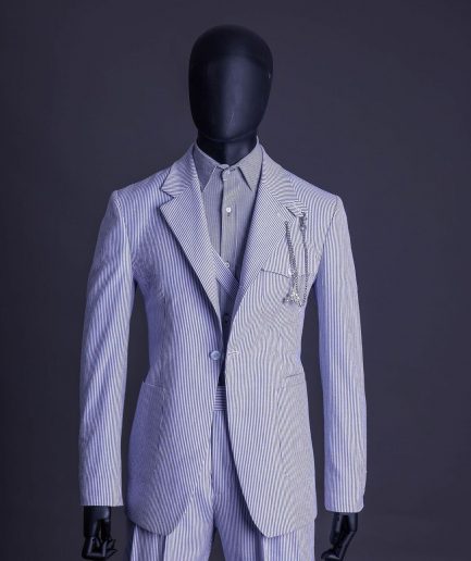 A monochrome seersucker (rail road stripe) notch lapel suit
