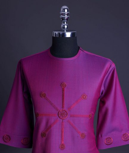 A Magenta, herringbone fabric, and interconnected ring embroidery details African senator kaftan native