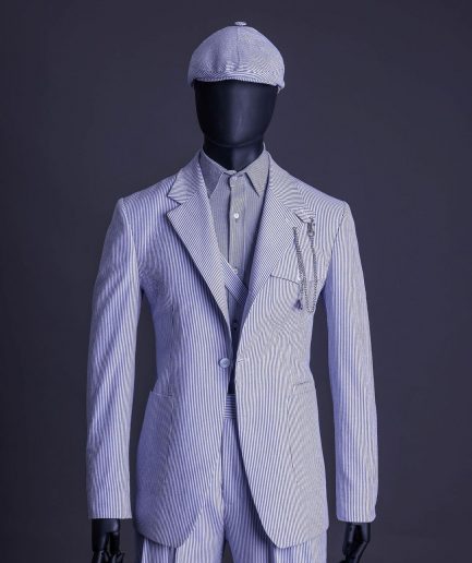 A monochrome seersucker (rail road stripe) notch lapel suit