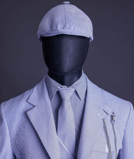 A monochrome seersucker (rail road stripe) notch lapel suit