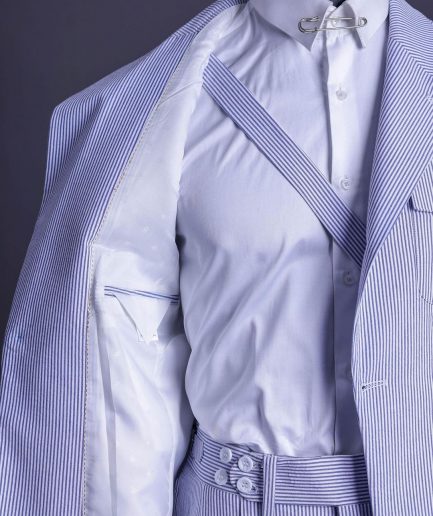A monochrome seersucker (rail road stripe) notch lapel suit