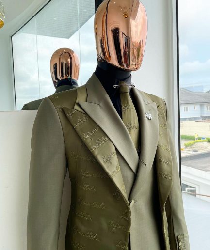 A Dark olive green "scritto” (inscribe your name), layered 4 lapels, double-breasted, out-waisted jointed jacket