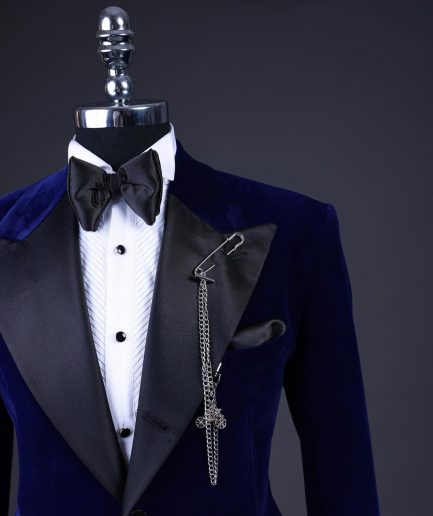 A Navy blue, soaked velvet peak lapel tuxedo suit