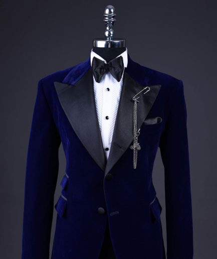 A Navy blue, soaked velvet peak lapel tuxedo suit