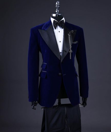A Navy blue, soaked velvet peak lapel tuxedo suit