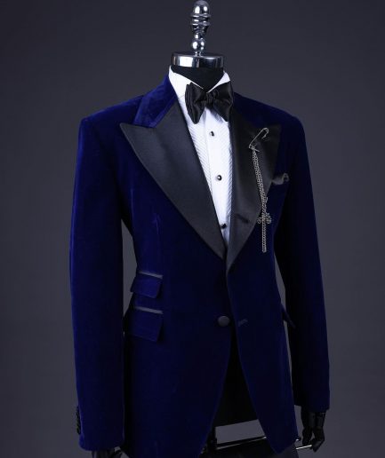 A Navy blue, soaked velvet peak lapel tuxedo suit