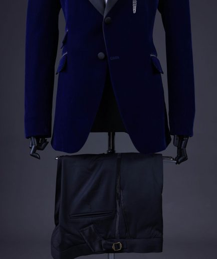 A Navy blue, soaked velvet peak lapel tuxedo suit