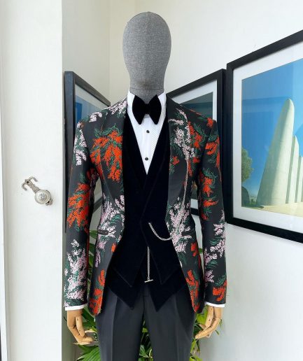 A “spring” orange, pink and green splashed floral layered front cut, shawl lapel tuxedo suit