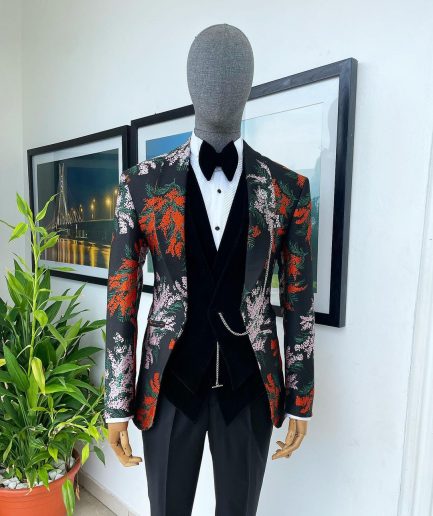 A “spring” orange, pink and green splashed floral layered front cut, shawl lapel tuxedo suit