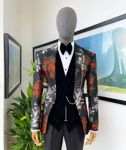 A “spring” orange, pink and green splashed floral layered front cut, shawl lapel tuxedo suit