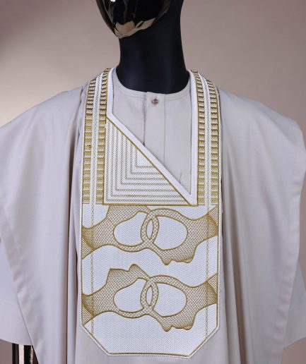 A porcelain, connected medulla and wooven pattern embroidery detailing agbada