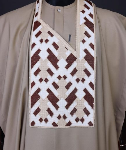 A Tortilla brown, layered tettri pattern embroidery detailing agbada