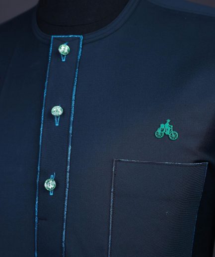 A Sacramento green, Front flap with green Swarovski buttons, patch pocket, 3/4 sleeve details African senator kaftan native.