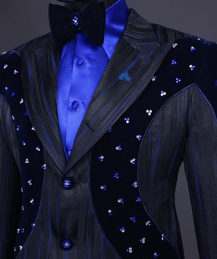 A “Prodigal” lashed midnight blue, admiral blue and splashed black metallic jacquard trench suit