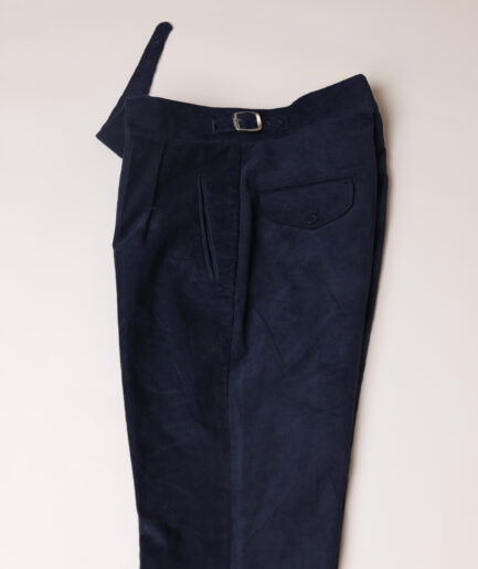 Gurkha trousers with pleats, double side strap buckles, slanted front welt pockets, and a back patch pocket.