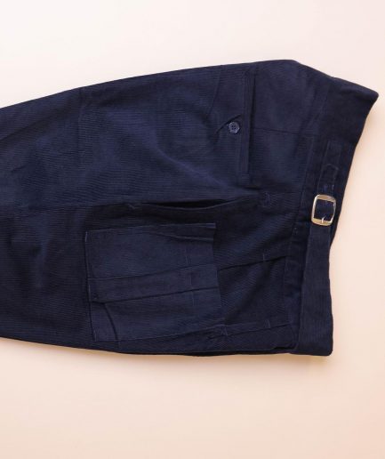 A “Gurkha”pant shorts with pleats, double side strap buckle, combat patch pocket.