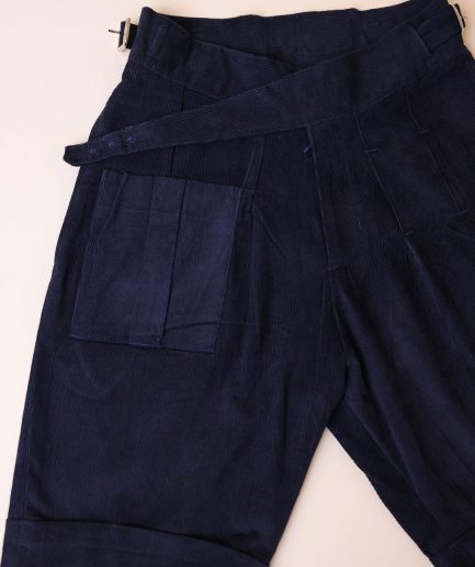 A “Gurkha”pant shorts with pleats, double side strap buckle, combat patch pocket.