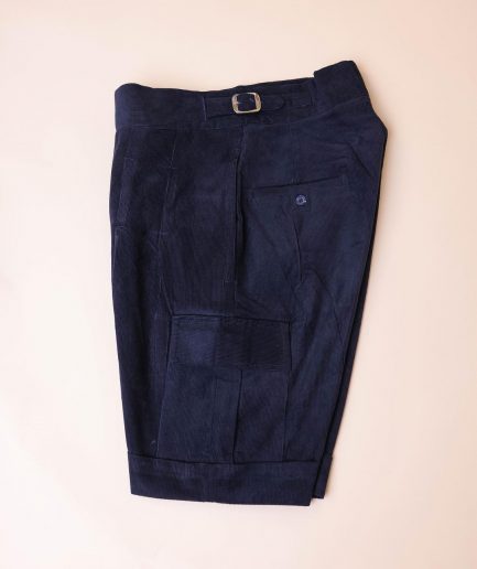 A “Gurkha”pant shorts with pleats, double side strap buckle, combat patch pocket.