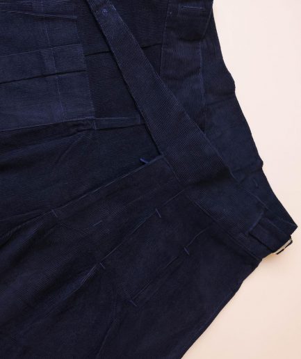 A “Gurkha”pant shorts with pleats, double side strap buckle, combat patch pocket.