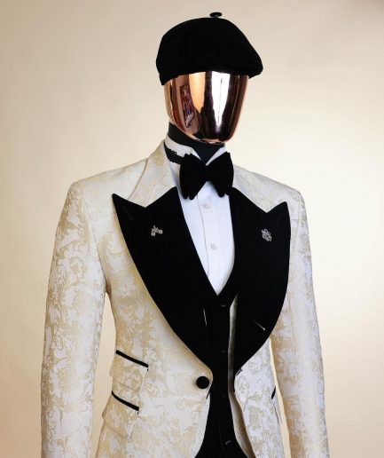 An Ivory white and Gold Floral patterned Peak lapel metallic jacquard tuxedo suit.