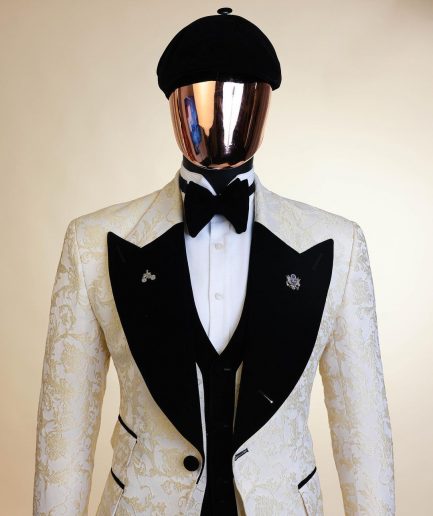 An Ivory white and Gold Floral patterned Peak lapel metallic jacquard tuxedo suit.