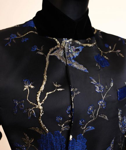 A Gold, black and blue double breasted safari suit, raven and forest metallic pattern jacquard