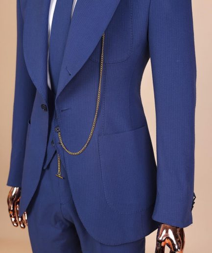 A “peaky blinders” navy blue seersucker fabric knitted peak lapel suit