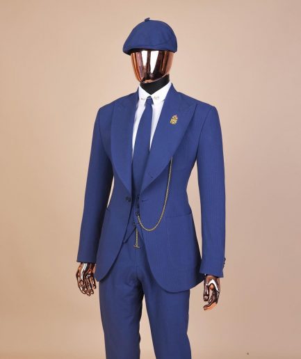 A “peaky blinders” navy blue seersucker fabric knitted peak lapel suit