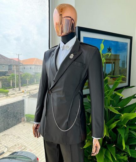A #Herd” brown leather, knitted & outer layered peak lapel wrap suit
