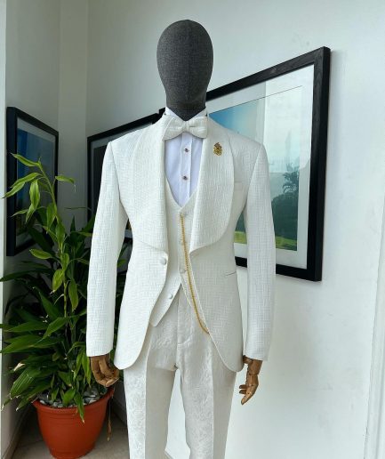 An ivory white, elastic, basket weave layered floral jacquard shawl lapel tuxedo suit.