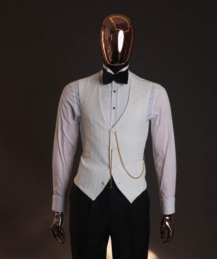 An Ivory white, elastic, basket weave layered floral jacquard shawl lapel tuxedo suit.