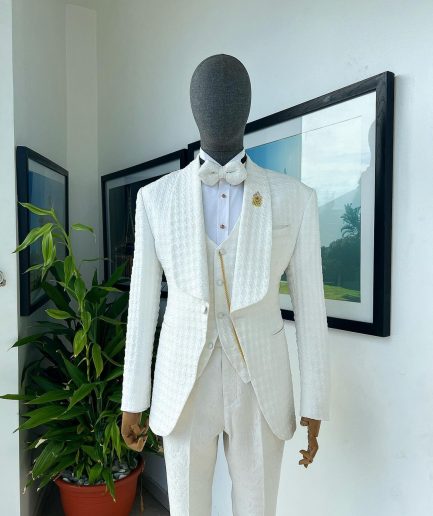 An Ivory white, swollen floral jacquard shawl lapel tuxedo suit.