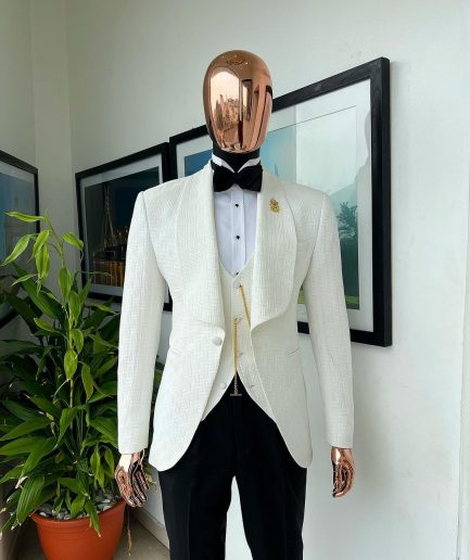 An Ivory white, elastic, basket weave layered floral jacquard shawl lapel tuxedo suit.
