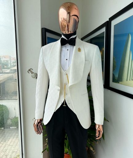 An Ivory white, elastic, basket weave layered floral jacquard shawl lapel tuxedo suit.