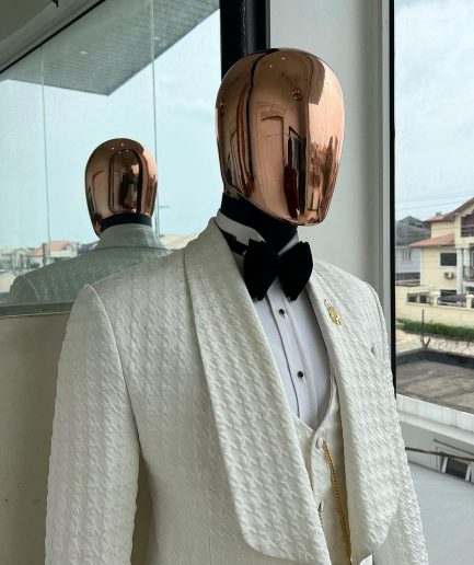 An Ivory white, swollen floral jacquard shawl lapel tuxedo suit