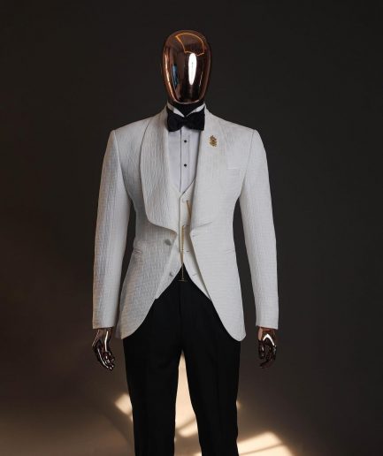 An Ivory white, elastic, basket weave layered floral jacquard shawl lapel tuxedo suit.