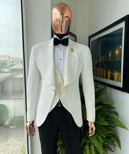 An Ivory white, elastic, basket weave layered floral jacquard shawl lapel tuxedo suit.