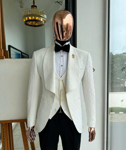 An Ivory white, elastic, basket weave layered floral jacquard shawl lapel tuxedo suit.