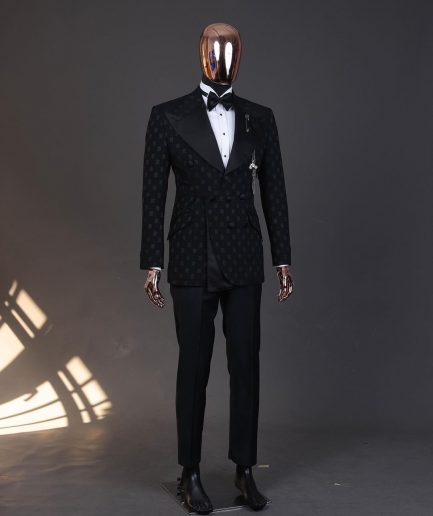 An Inverted “Pirate”, knitted, charcoal black with distributed square pattern jacquard peak lapel, 9 button tuxedo suit.