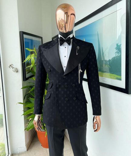 An Inverted “Pirate”, knitted, charcoal black with distributed square pattern jacquard peak lapel, 9 button tuxedo suit.