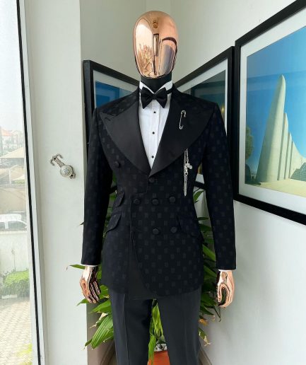 An Inverted “Pirate”, knitted, charcoal black with distributed square pattern jacquard peak lapel, 9 button tuxedo suit.
