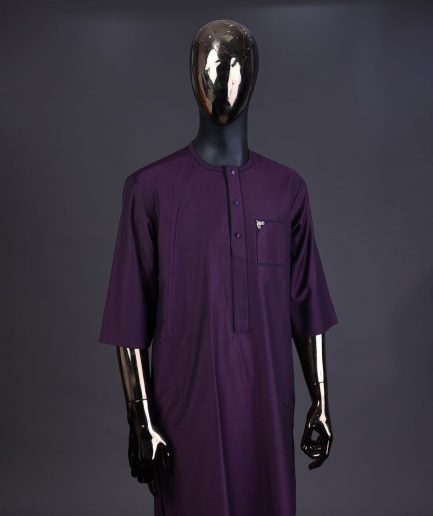An eggplant purple front flap with matching Swarovski button detailing kaftan and Sokoto