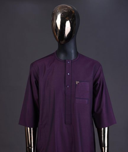 An eggplant purple front flap with matching Swarovski button detailing kaftan and Sokoto
