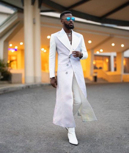 A monochrome, peak lapel, light multi-color dyed trench double breasted jacquard with bunny button details suit