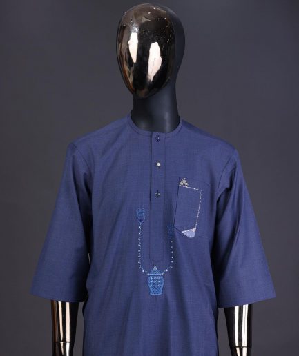 A Navy blue front flap with a clear view Swarovski button, connected sailor and basket embroidery detailing kaftan and Sokoto