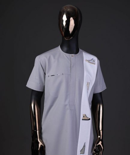 A pewter grey front flap with gold Swarovski button detailing and side all-stars embroidery detailing on white kaftan and Sokoto
