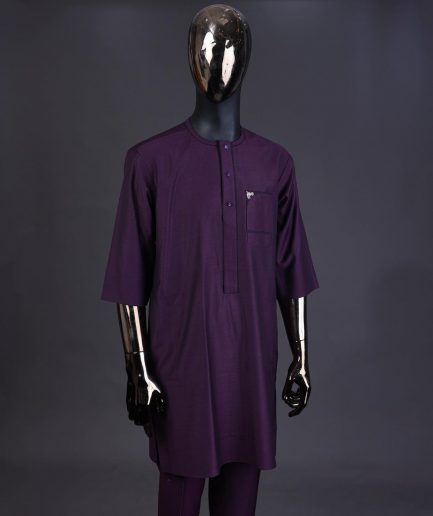 An eggplant purple front flap with matching Swarovski button detailing kaftan and Sokoto