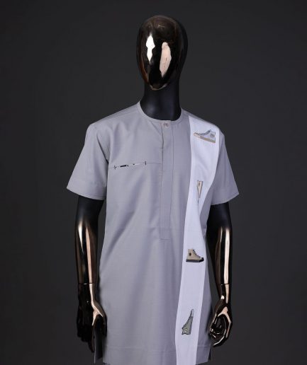 A pewter grey front flap with gold Swarovski button detailing and side all-stars embroidery detailing on white kaftan and Sokoto